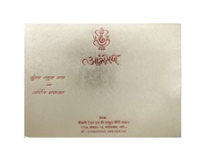 Hindu wedding card in red satin and golden