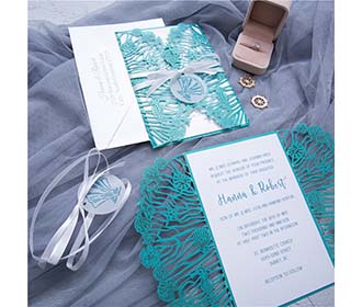 Beach wedding designer laser cut invitation in teal shimmer