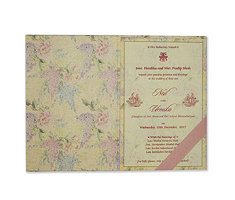 Beautiful Indian wedding invite in pastel colors with printed flowers