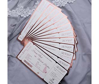 Boarding pass destination wedding invitation in metallic pink