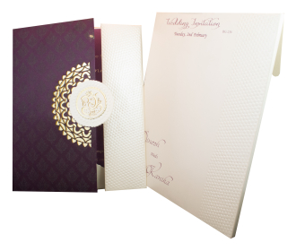Designer gatefold style invite in ivory and purple with cut out Ganesha symbol