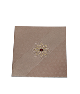 Elegant Indian wedding card in golden brown with flower design