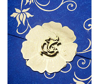 Four fold wedding card in blue with ganesha & floral designs