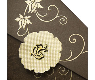 Four fold wedding card in brown with ganesha & floral designs