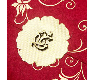 Four fold wedding card in red with ganesha & floral designs