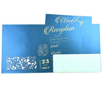 Ganesha theme Hindu wedding card in blue with laser cut floral patterns