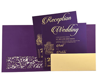 Ganesha theme Hindu wedding card in purple with laser cut floral patterns