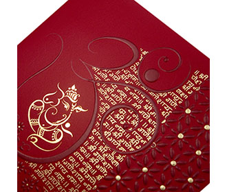 Ganesha themed hindu wedding card in red & golden