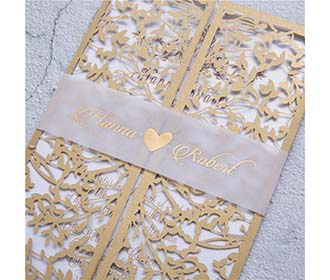 Gate fold wedding invitation in golden colour with a mesh of leaves