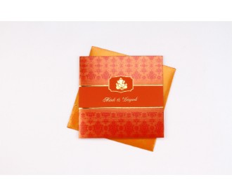 Hindu wedding card in orange and red with Ganesha design