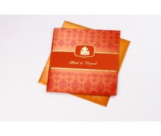 Hindu wedding card in orange and red with Ganesha design