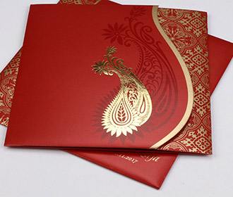 Hindu wedding invite in red with golden paisley