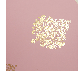 Indian wedding card in baby pink with floral motifs