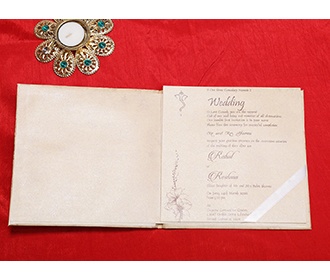 Indian wedding card in beige with embossed floral designs