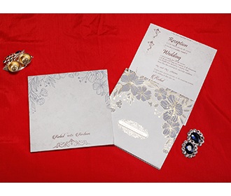 Indian wedding card in cream with embossed floral designs