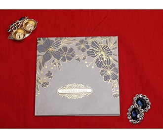Indian wedding card in cream with embossed floral designs