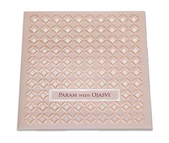 Indian wedding invitation in laser cut geometric pattern in tan colour