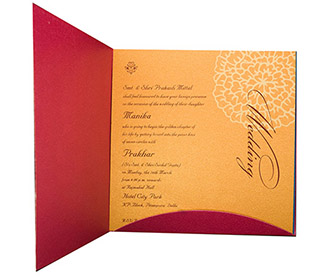 Indian wedding Invite in Pink with cut out golden Floral pattern