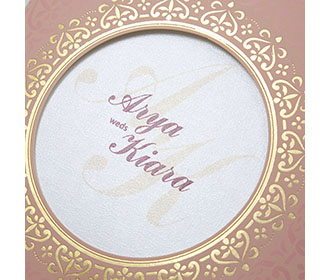 Invitation with a decorated circular frame in dusty pink colour