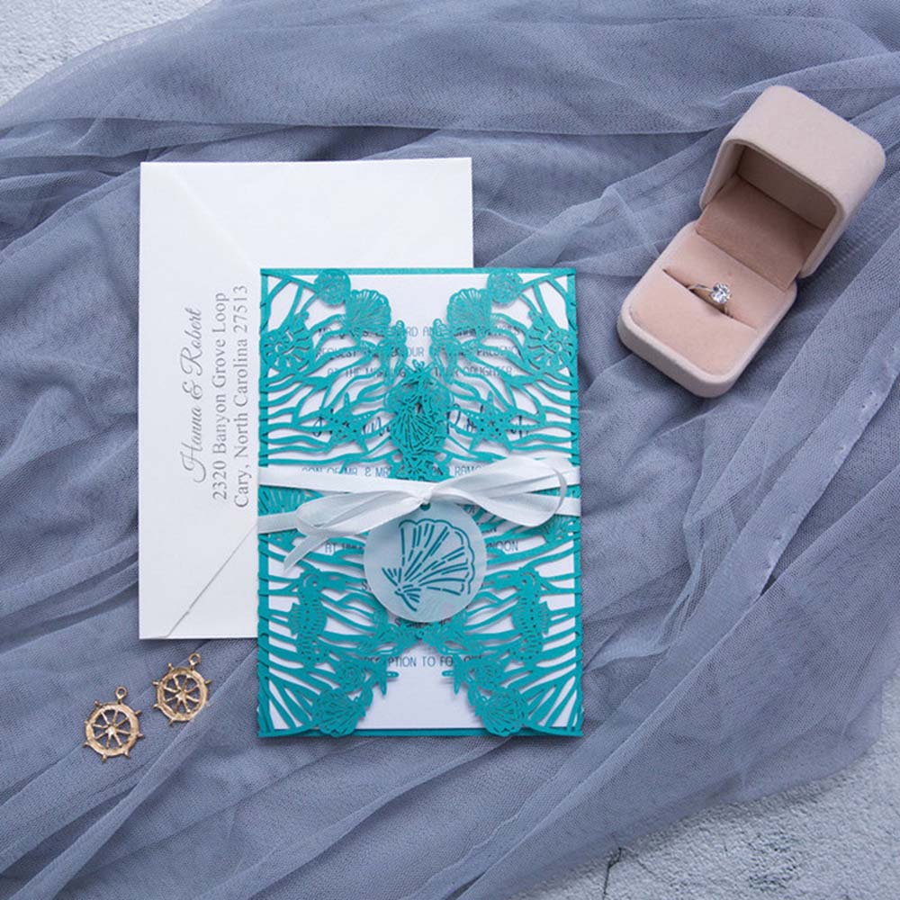 Beach wedding designer laser cut invitation in teal shimmer