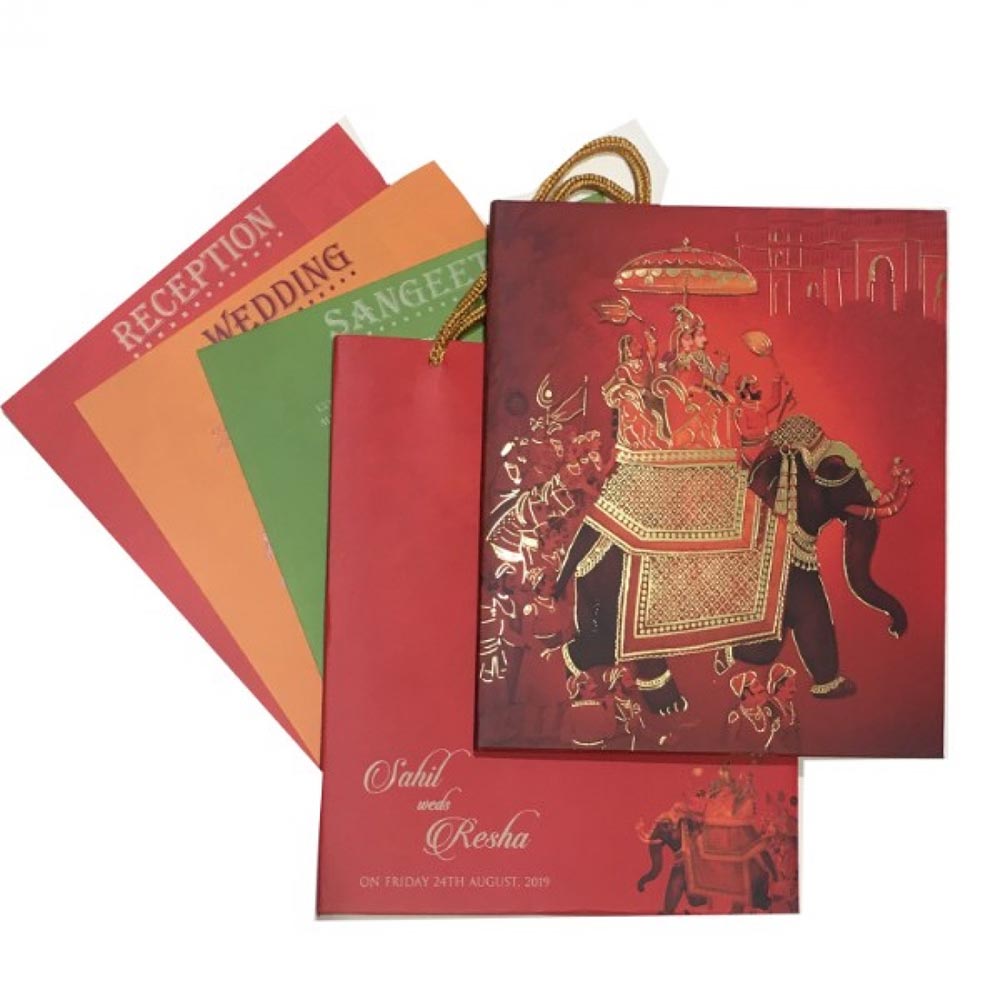 Beautiful Royal Indian wedding invitation card in rich red colour