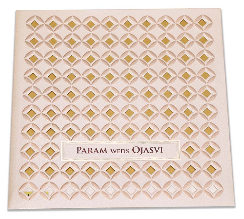 Indian wedding invitation in laser cut geometric pattern in cream colour