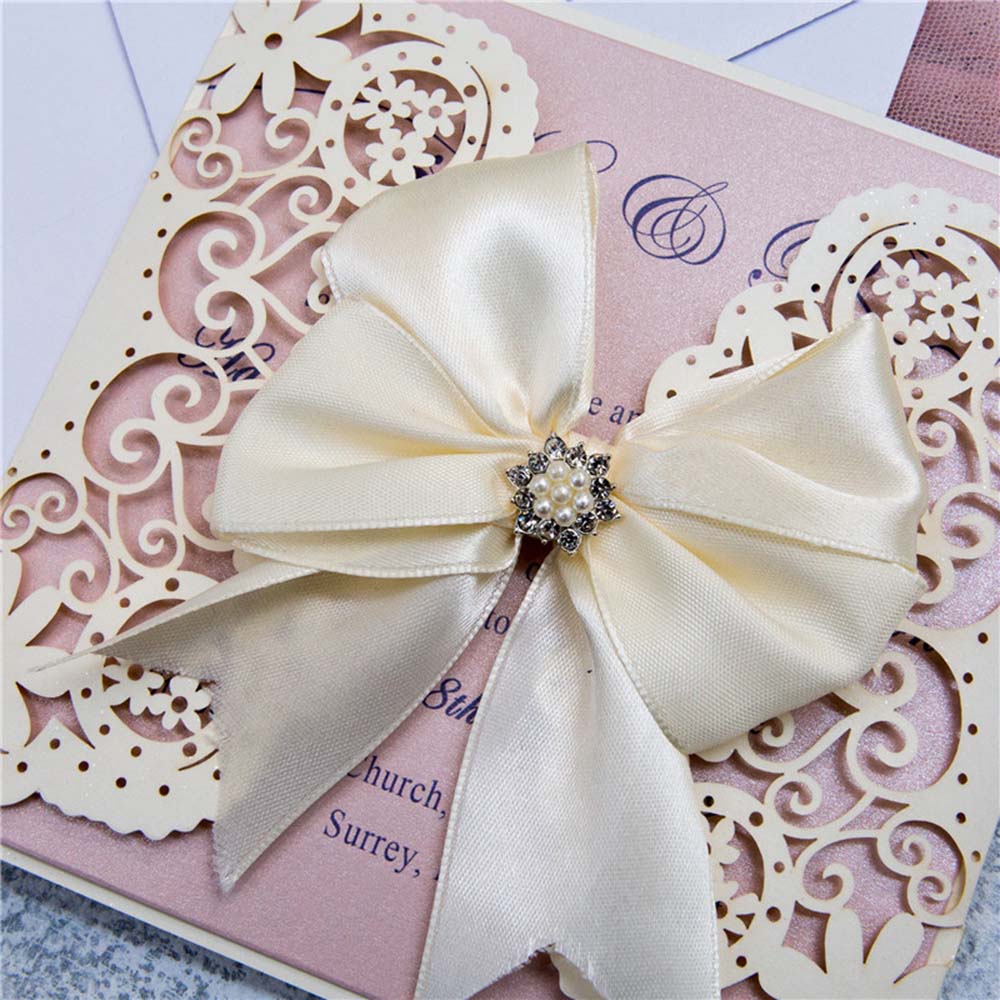 Laser cut wedding invitation in cream with ribbon bow and embellishments - Click Image to Close