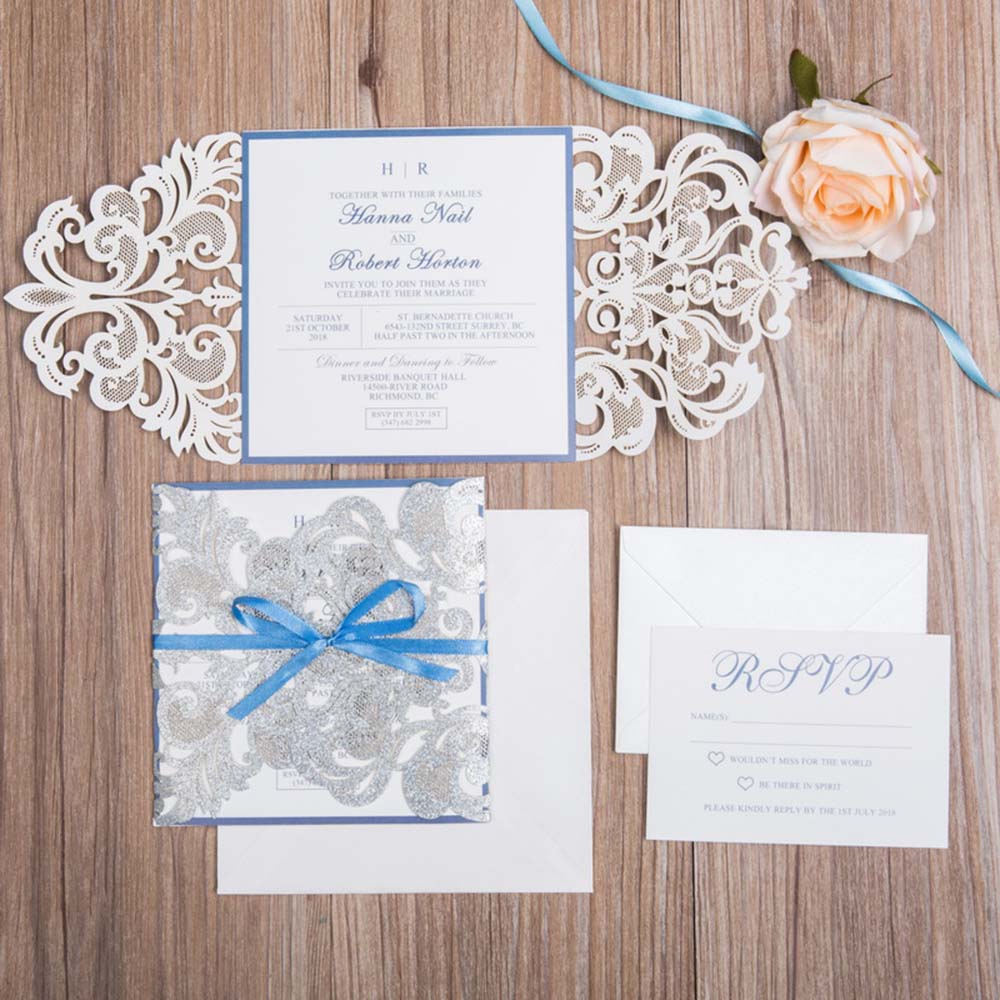 Silver glitter laser cut wedding invite with blue lace