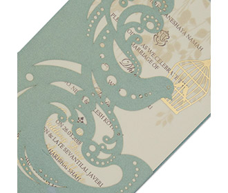 Laser cut Indian wedding invite in metallic blue with a dove