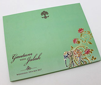 Laser cut royal indian wedding invitation in pastel green