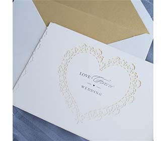 Laser cut wedding invitation in Ivory glitter and a beautiful heart cutout