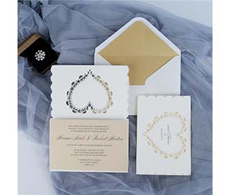 Laser cut wedding invitation in Ivory glitter and a beautiful heart cutout