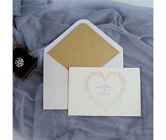 Laser cut wedding invitation in Ivory glitter and a beautiful heart cutout - 