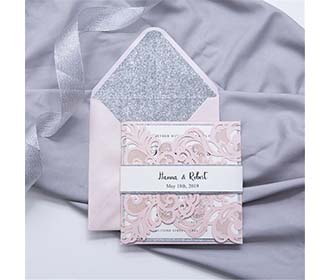 Luxurious laser cut wedding invite in pink and silver glitter