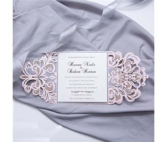 Luxurious laser cut wedding invite in pink and silver glitter