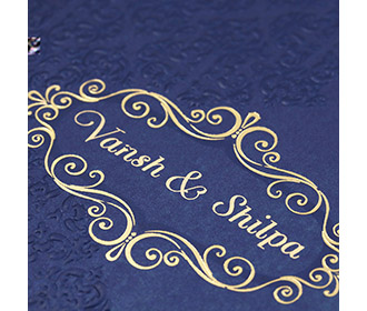 Multfaith Indian wedding card in royal blue & embossed floral motifs