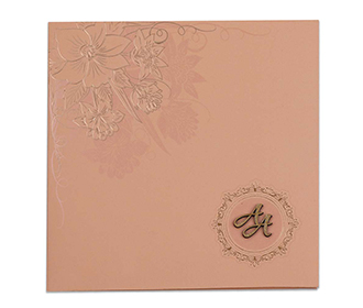 Peach colour Indian wedding invite with embossed flowers