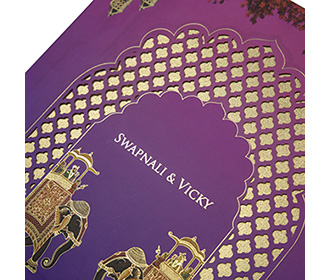 Peacock themed Indian wedding invitation in pastel green & purple
