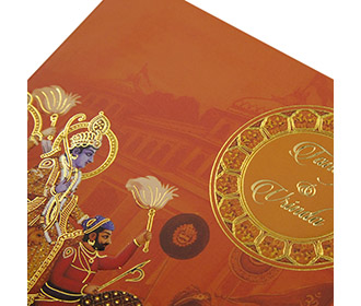 Royal Indian wedding card in traditional orange colour