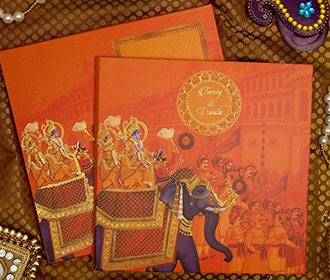 Royal Indian wedding card in traditional orange colour