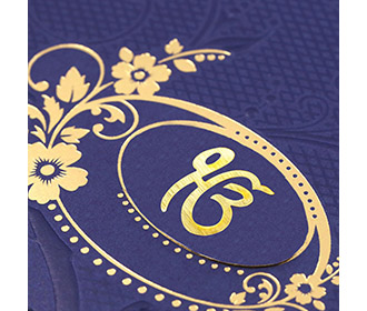Sikh wedding invitation in navy blue with embossed floral design