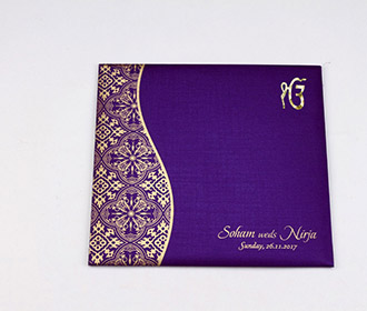 Sikh wedding invite in purple with golden paisley