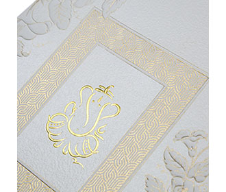Traditional Ganesha themed Indian wedding invite in Ivory