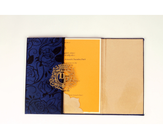 Wedding Invitation in Blue Satin with Floral Motifs.