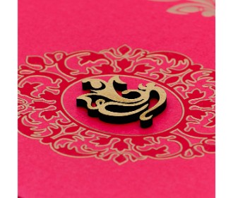 Beautiful pink invitation card with floral design and laser cut Ganesha