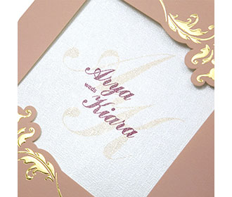 Wedding card with a decorated square frame in dusty pink colour