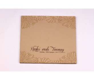 Wedding invite in tan and golden with embossed floral design