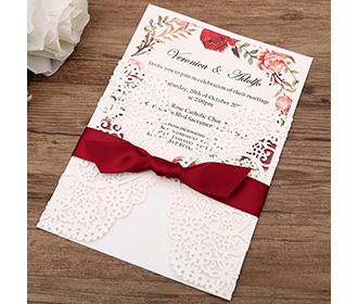 White gatefold laser cut engagement and weddding invitation card with red ribbon